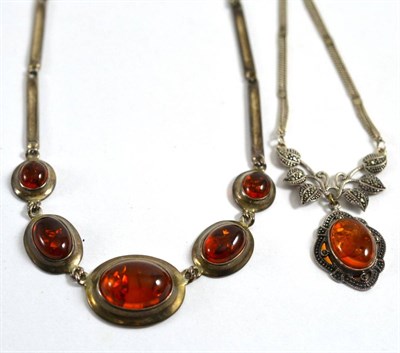 Lot 75 - An amber fire stone necklace and an amber and marcasite necklace (2)