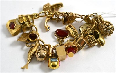 Lot 76 - A charm bracelet hung with twenty six charms, including The Bar Gate Southampton, a Masonic...