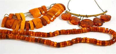 Lot 89 - A Russian silver gilt amber necklace and two amber bead necklaces (3)