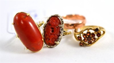 Lot 114 - Two coral rings, a 9ct rose gold band ring and a 9ct gold garnet cluster ring (4)