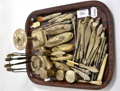 Lot 180 - A collection of silver handled nail files, tweezers and brushes, silver nail buffers, silver...