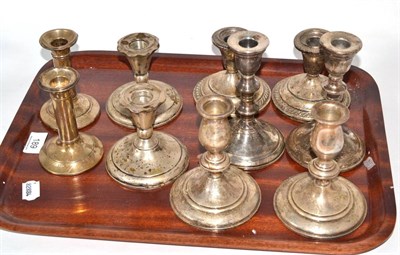 Lot 189 - Five pairs of silver dwarf candlesticks