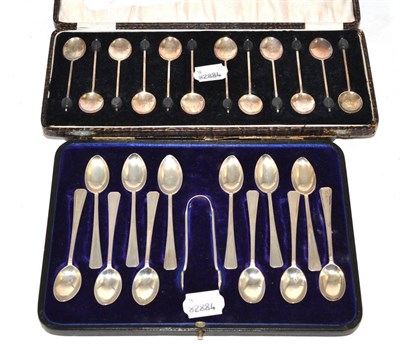 Lot 200 - A cased set of twelve silver coffee bean spoons and a cased set of twelve silver teaspoons with...