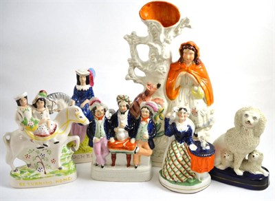 Lot 209 - Six various Staffordshire pottery figures including a poodle group