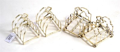 Lot 228 - Two pairs of silver four division toast racks