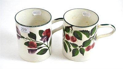 Lot 229 - A Wemyss Ware tankard decorated with cherries and another decorated with flowers (2)