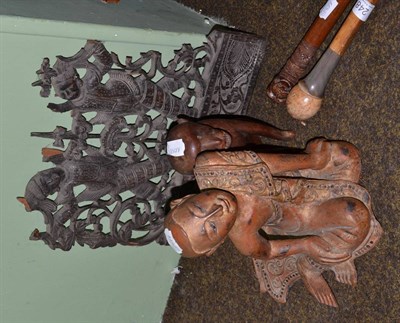 Lot 248 - Eastern carved wood cane; another with horn collar and turned wood pommel; and three Eastern carved