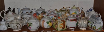 Lot 252 - A collection of thirty three various ceramic teapots, mostly 20th century in date including cottage