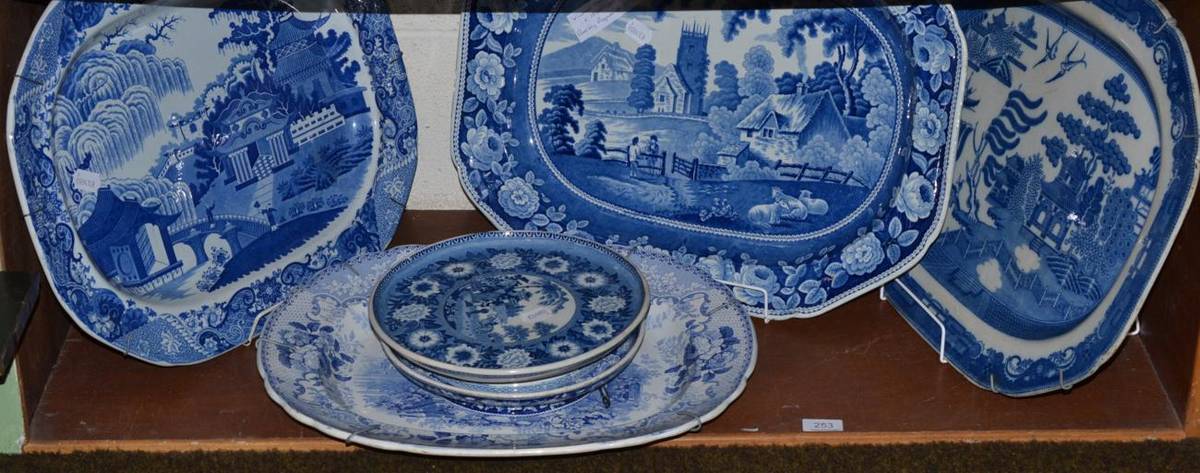 Lot 253 - A group of blue and white pottery including four meat plates; two Old Willow, Village Church...