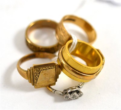 Lot 277 - A 9ct gold textured band ring, three 9ct gold signet rings, a two colour ring an 18ct gold...