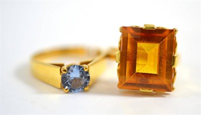 Lot 283 - A 9ct gold blue zircon ring and a citrine ring (2)