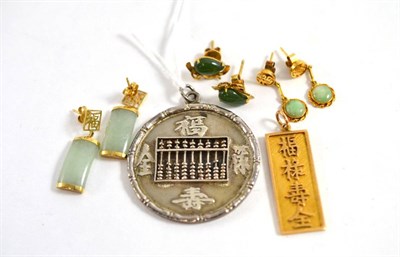 Lot 288 - A Chinese abacus pendant, a Chinese pendant, stamped 14K and three pairs of jade earrings