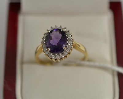 Lot 304 - A 9ct gold amethyst and diamond cluster ring