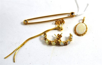 Lot 311 - A 9ct gold tie bar, an opal pendant, a pair of 9ct gold opal half hoop earrings, and a pair of stud