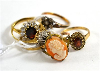 Lot 312 - A 9ct gold garnet and cubic zirconia cluster ring, a diamond custer ring (a.f.) and four other...