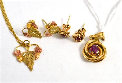 Lot 315 - A ruby pendant and earring suite, stamped '14K' and a leaf design necklace and earring suite