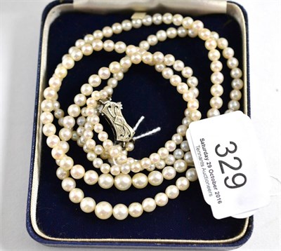 Lot 329 - A cultured pearl two row necklace with a diamond set clasp