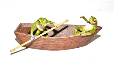 Lot 334 - A cold painted bronze of two frogs in a boat