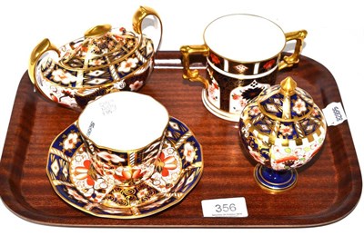 Lot 356 - Four Royal Crown Derby items including a twin handled mug, cup and saucer, two jugs and covers (4)