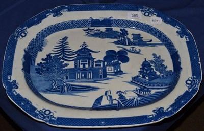 Lot 365 - A late 18th century pearlware blue and white transfer printed meat plate, Old Willow pattern...