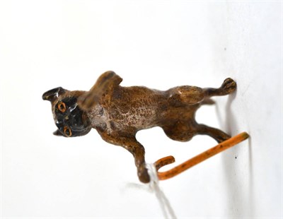 Lot 397 - A cold painted bronze of a pug with a walking stick