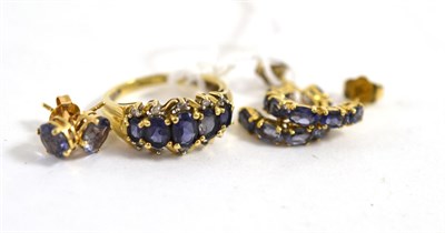 Lot 398 - A 9ct gold tanzanite ring and two pairs of 9ct gold tanzanite set earrings, with post fittings (3)