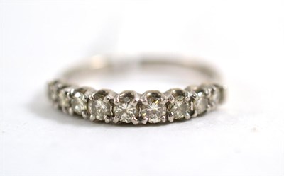 Lot 407 - An 18ct white gold half hoop ring