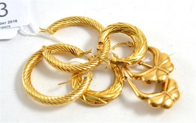 Lot 413 - Three pairs of 9ct gold hoop earrings (3)