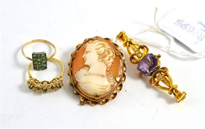 Lot 416 - An amethyst and seed pearl scroll bar brooch, a cameo brooch, a paste set ring and a gem set triple