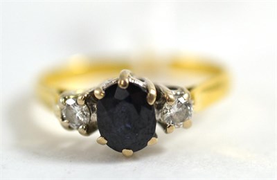 Lot 418 - An 18ct gold sapphire and diamond ring