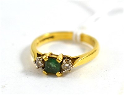 Lot 444 - An 18ct gold emerald and diamond ring