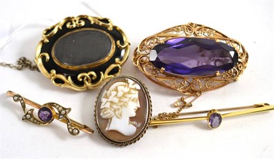 Lot 446 - A Victorian mourning brooch, two amethyst bracelets and two other brooches