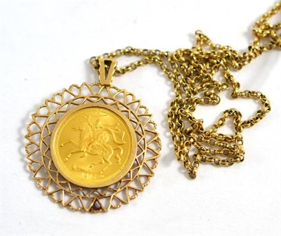 Lot 453 - An Elizabeth II Isle of Man 1973 gold sovereign, loose mount in fancy frame and chain