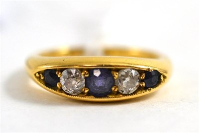 Lot 454 - An 18ct gold old cut diamond and sapphire ring