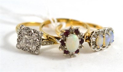 Lot 465 - A 9ct gold opal three stone ring; a 9ct gold opal, garnet and diamond cluster ring and an...