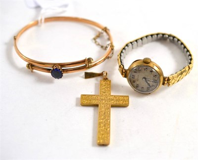 Lot 470 - A blue stone set twist bangle, a cross pendant and a wristwatch (3)