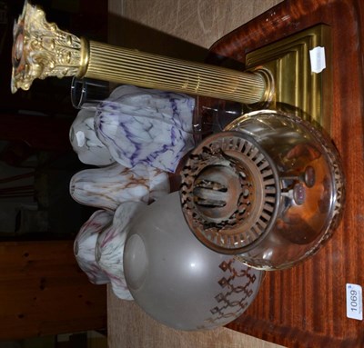 Lot 1069 - Brass Corinthian column oil lamp and shade and six 1950's glass shades