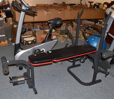 Lot 1104 - A home gymnasium comprising a Vision Fitness fitness bike E3200, an Addidas weights bench, an...