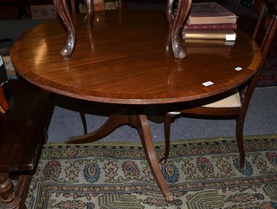 Lot 1149 - A mahogany snap top circular breakfast table