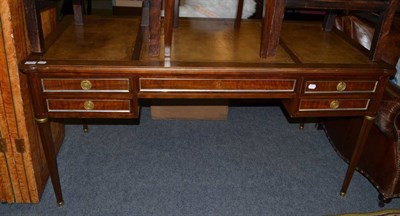 Lot 1151 - A Regency style mahogany writing desk with tooled green leather inserts