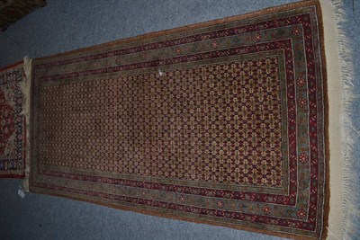 Lot 1152 - Doruksh rug, Khorasan, East Iran, the raspberry lattice field enclosed by multiple narrow...