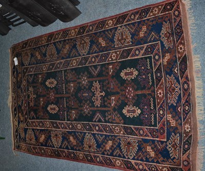 Lot 1154 - Yagcibedir rug, West Anatolia, the ink field of hooked stylised vines enclose by similar...