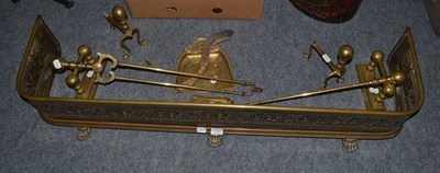 Lot 1187 - A brass fender, two brass fire irons, two pairs of andirons and crumb tray and a brush