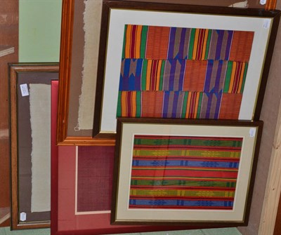 Lot 1227 - Five eastern framed panels and embroideries including two brightly coloured Ghanian striped...