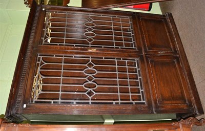 Lot 1256 - An oak bookcase enclosed by leaded glazed doors