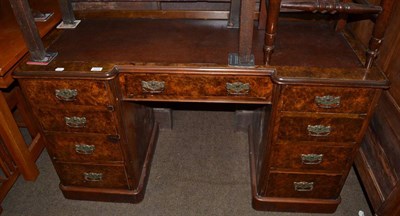 Lot 1274 - Walnut nine drawer leather top desk