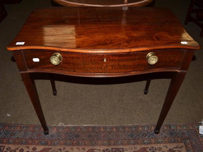 Lot 1278 - A George III mahogany serpentine side table