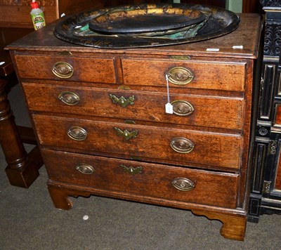 Lot 1307 - An 18th century two short over three long oak chest of drawers, graduated bracket feet