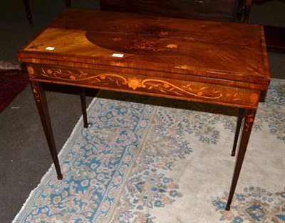 Lot 1337 - A Dutch rosewood and floral marquetry fold over card table, 92cm wide, 73cm high