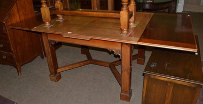 Lot 1352 - A mahogany draw leaf dining table with blind fret carved square section legs